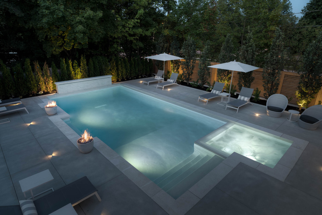 A Pool Framed with Multiple Concrete Fire Pits